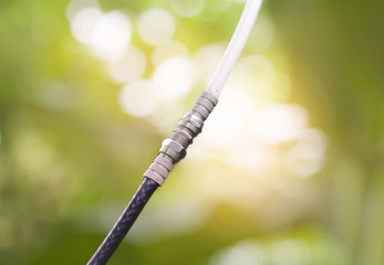 The white line connects to the black line the background is a bokeh from the sun.It can inspire the interactions of people in the world, even though they are different.White or black