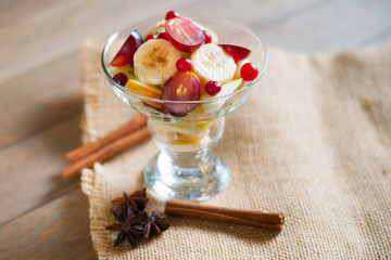 Fruit salad and spices on a canvas textile 