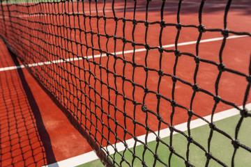Tennis net on a tennis court background
