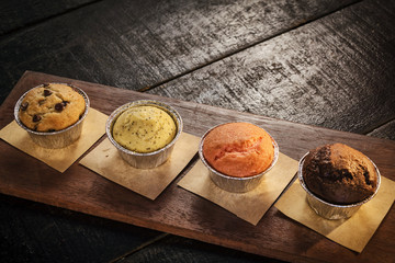 mixed freshly baked muffins in cozy coffeeshop interior