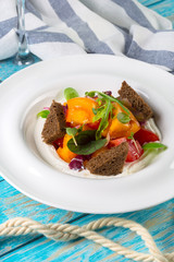 Fresh vegetable salad on wooden background