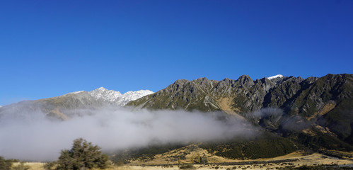 Low level of cloud with high mountain range background