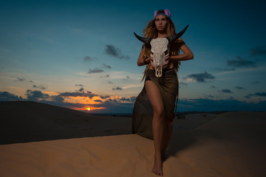 Woman shaman hold cow skull