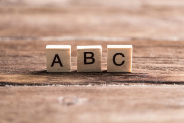 wooden elements with the letters collected in the word abc