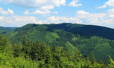 Fototapeta na wymiar landscape of Beskydy mountains with green forests on sunny summer day
