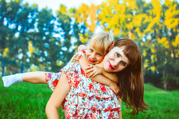 Girl with mom in nature