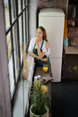 Enjoy woman breakfast, good mornong on kitchen, with glass orange juice