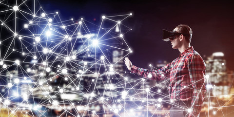 Guy wearing checked shirt and virtual mask reaching hand to feel