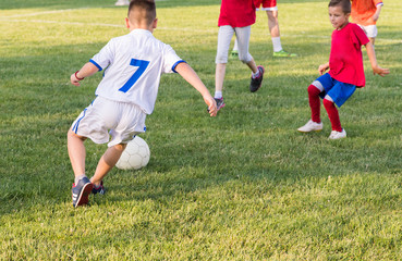 Kids soccer football - children players match on soccer field