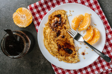 Oatmeal omelette with fruit. top view