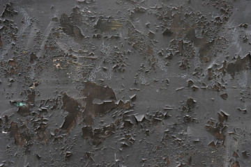 Metal texture. Red rusty surface with peeling black paint, background, texture