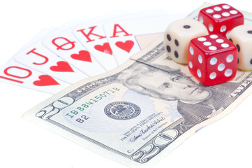Dices and game cards on dollars.
