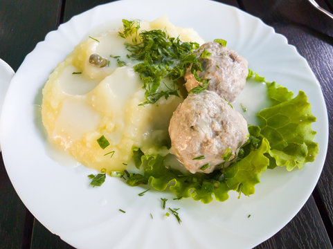 Koenigsberg Klops, a traditional German dish, mashed potatoes with meatballs, with white sauce