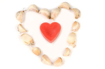 Conceptual photo of a whole garlic in a heart