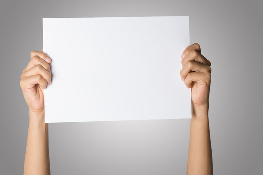 Close Up of woman hand holding blank paper isolated on white background