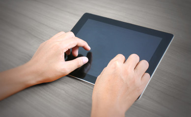  hands multitasking man using tablet