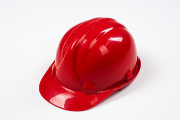 Red construction helmet shot isolated on white
