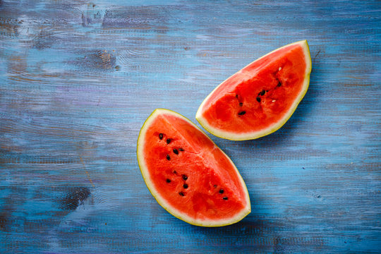 Slices Of Ripe Watermelon On A Blue Countertop