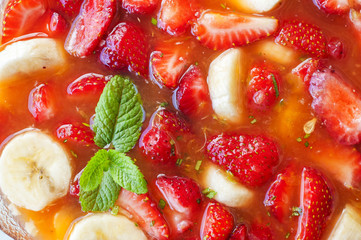 strawberries and bananas in orange juice