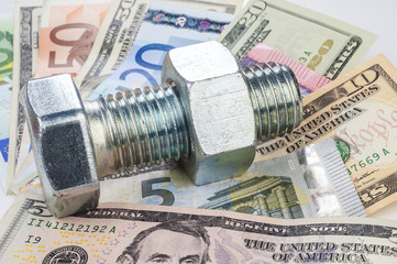 The screw, screw-driver and money