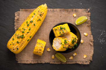 Tasty sweet grilled corn with onion sauce