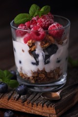 Yogurt, fresh blueberries and raspberries and granola