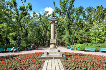 Central park with statue of Alexander Puskin, Chisinau, Moldova, sunny day blue sky trees and...