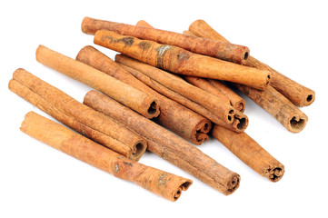 Cinnamon sticks and powder on white background