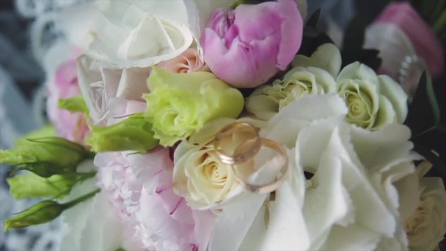 Rings newlyweds and a bride bouquet with accessories