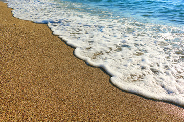 Sand on the beach and sea foam