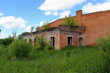 An old abandoned building of warehouse for mineral fertilizers in June 2017, Arsenyevo, Russia.