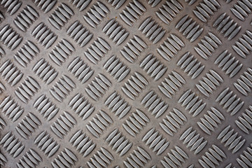 Diamond sheet. Background of metal diamond plate. Background of old metal plate in silver color. steel plate useful as a background cool cold tone. steel. stainless. metal. diamond background.
