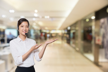 Asian woman pointing side