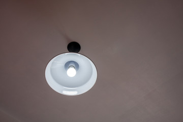 LED lamp on the dark background. selection focus, soft light, dark tone, black&white. Bright round...