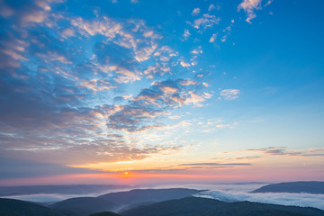  Beautiful sunrise above the clouds. Morning sky.