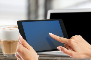 Hands with digital tablet.