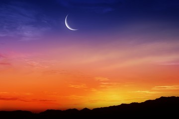 Ramadan background . Red sunset and moon . Mubarak background . Against the background of clouds . beautiful sky .