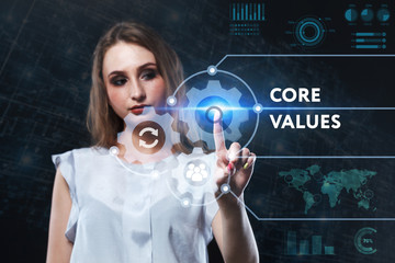 The concept of business, technology, the Internet and the network. A young entrepreneur working on a virtual screen of the future and sees the inscription: Core values