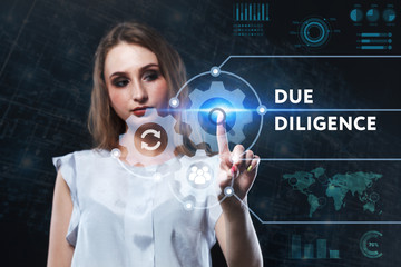 The concept of business, technology, the Internet and the network. A young entrepreneur working on a virtual screen of the future and sees the inscription: Due diligence