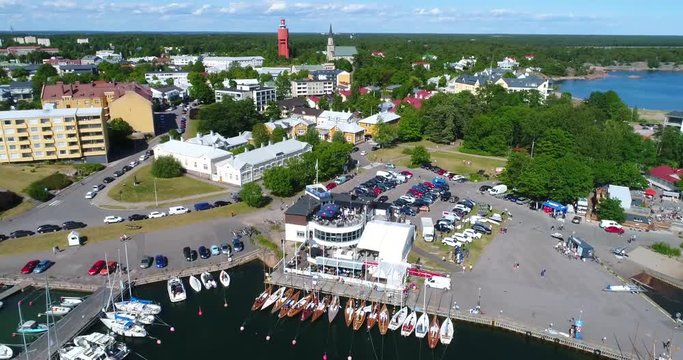 Hanko, Cinema 4k aerial tilt up view revealing the city, on Hango regatta day, in Uusimaa, Finland