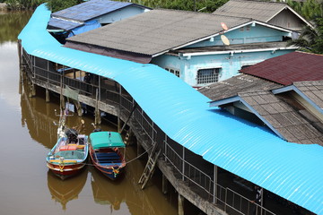 Colorful Fishing Boat dock at village pier in canal river