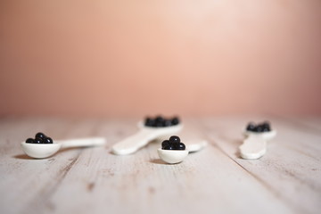 blackberry fruit baloons in ceramic spoons