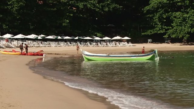 Beautiful boat moored near beach of Ilhabela, Brazil