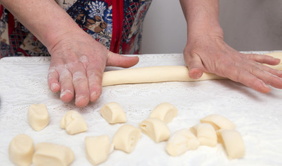 Cook cooks dough for pieces