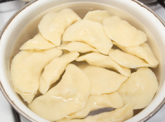 Vareniki with potatoes are cooked in a saucepan