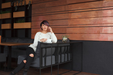 Sensual woman having coffee