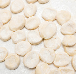 Fototapeta na wymiar Cook cooks dough for pieces
