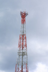 Telecommunication tower red and white antenna radio telephone mobile on sky background