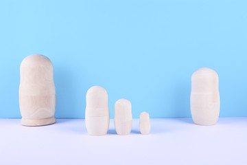 Set of russian dolls on blue background.