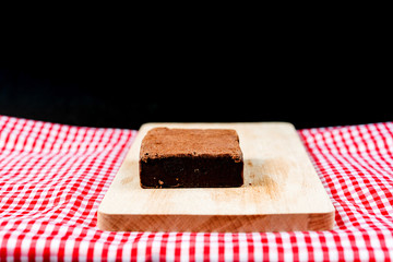 Chocolate Brownie cake on a dark plate